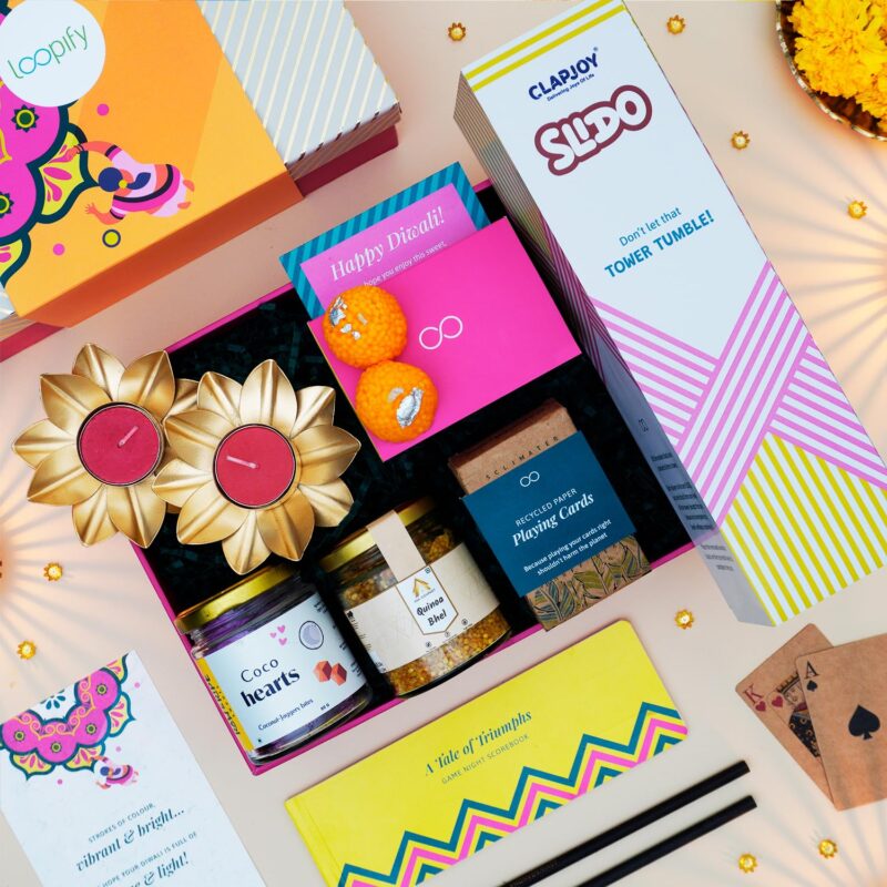 Loopify Festive Game Night Gift Hamper | Metal Diyas, Tea Lights, Candles, Quinoa Bhel, Jenga, Playing Cards, Score Book, Coco Hearts, Diwali Hamper