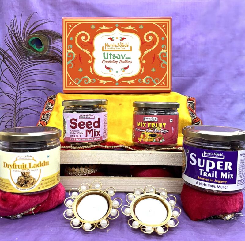 "NUTRIEFOODS" Enriching Your Taste Utsav-Celebrating Traditions Gift Hamper with Super Trail Mix, 7 in 1 Seed Mix, Butterscotch Laddu, Assorted Mix Fruit Toffess (Aam Papad, Guava, Strawberry), 2 Diya and Reusable Box, Festive Hamper